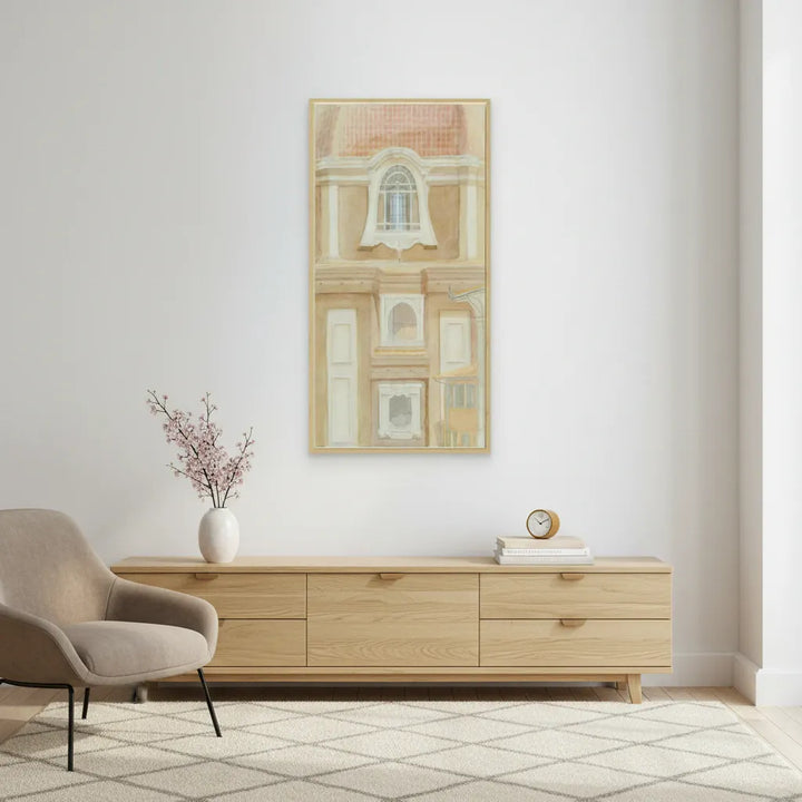 Modern living room with wooden sideboard, chair, and art on the wall.